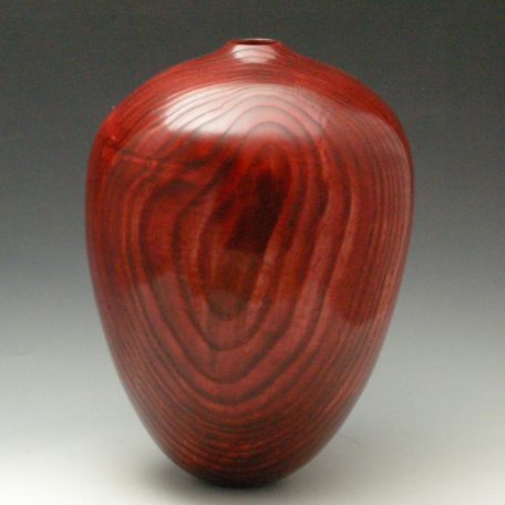 Red on Black Vessel, #469, 10 3/4” H x 8” Dia Sandtextured, dyed with a gloss oil finish.