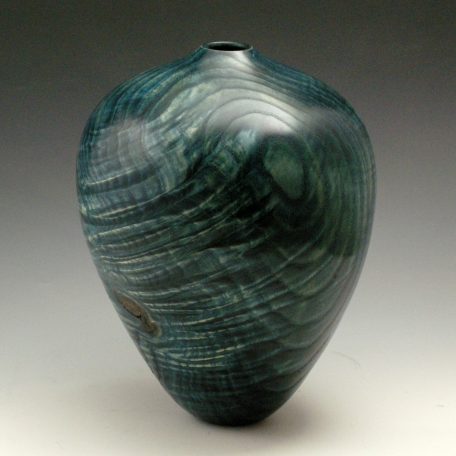 Windstorm, #467, 10” H x 8” Dia., Sandtextured, Ash dyed blue on black with a gloss oil finish.
