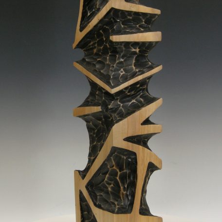 Column II Sculpture geometric form carved from Silver maple 24x6x6 dyed black with lacquer finish. 